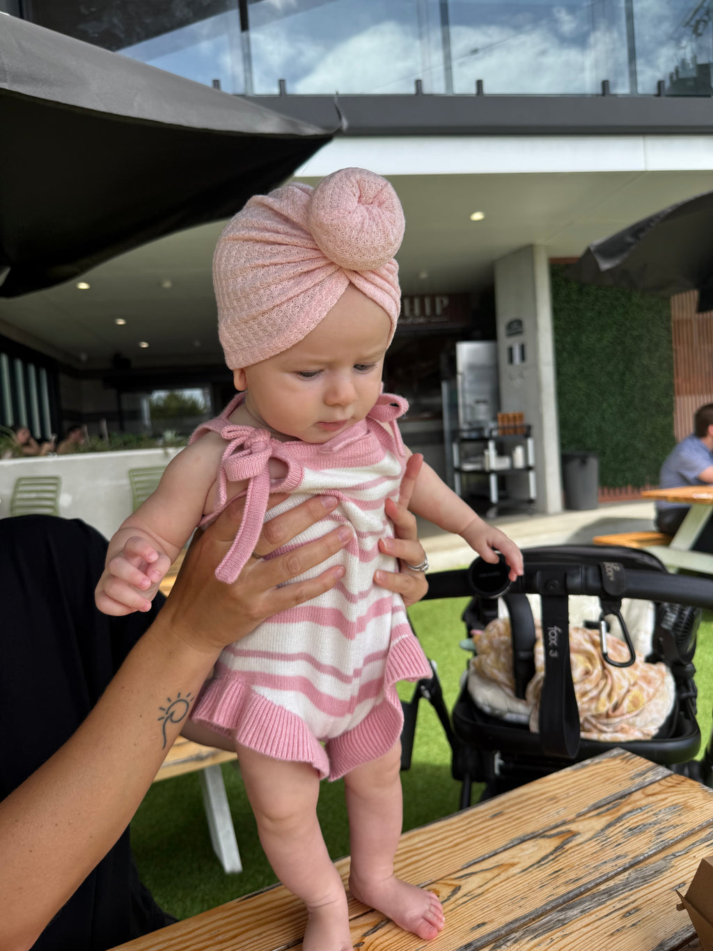 Little baby wearing a baby pink waffle knot turban